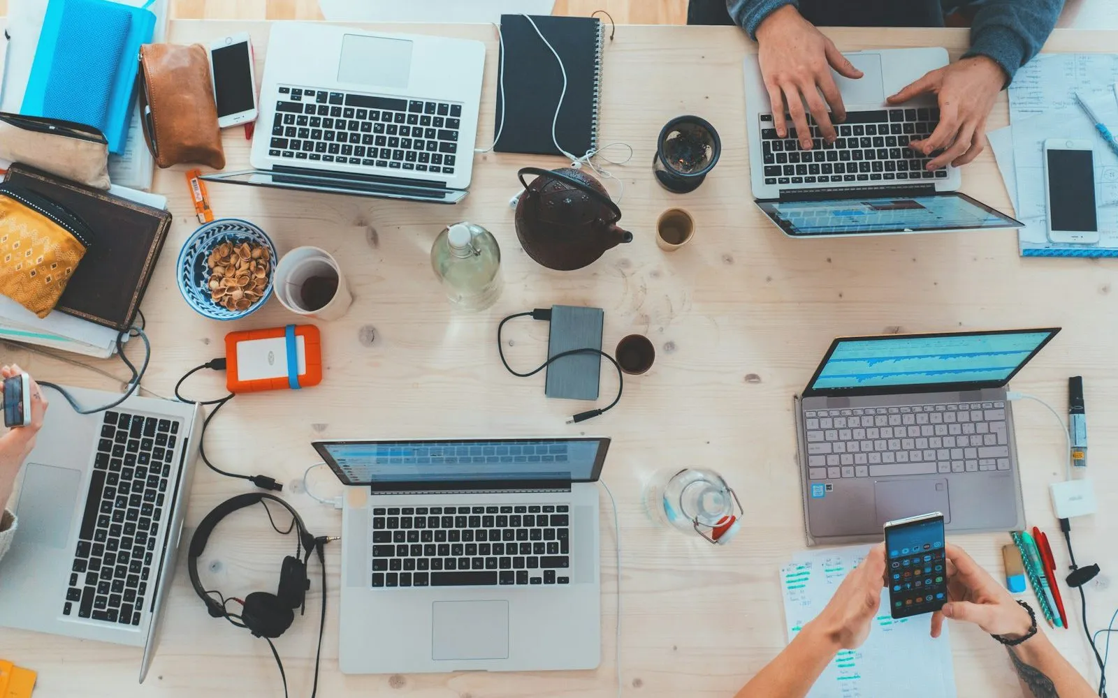 Freelance contract documents on a desk with a pen